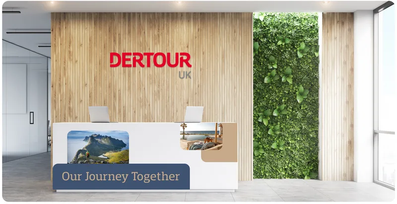 DERTOUR UK reception brand experience, the red wordmark on a timber wall.